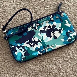 A blue and green floral Nine West wristlet. Used in new condition
